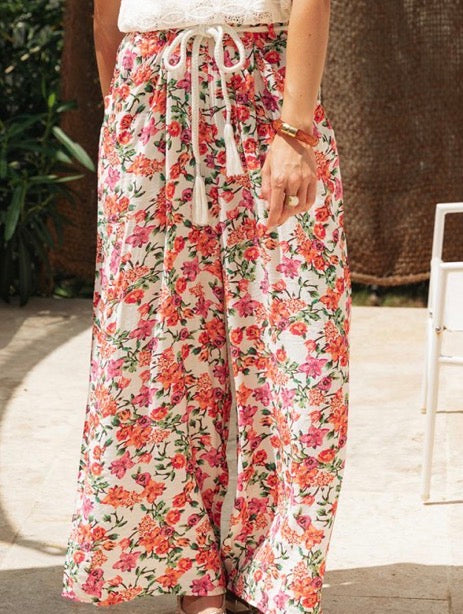 Pantalon fleurie avec cordon pompon