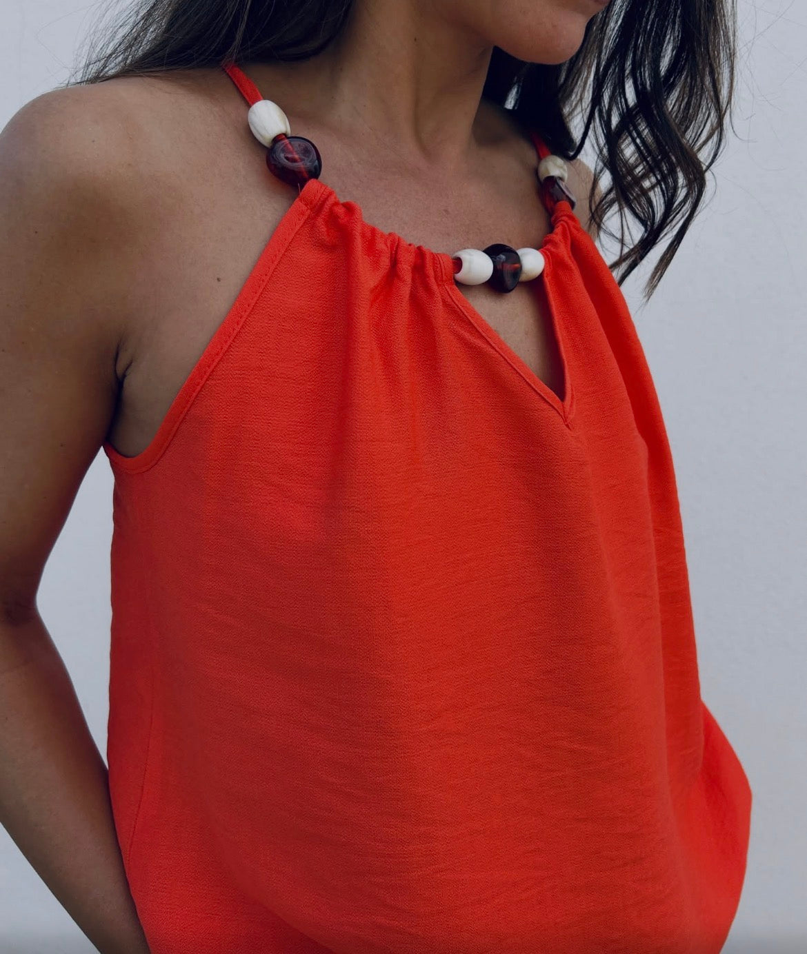Top débardeur couleur corail avec perles
