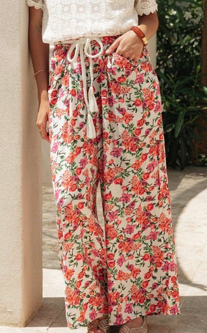 Pantalon fleurie avec cordon pompon