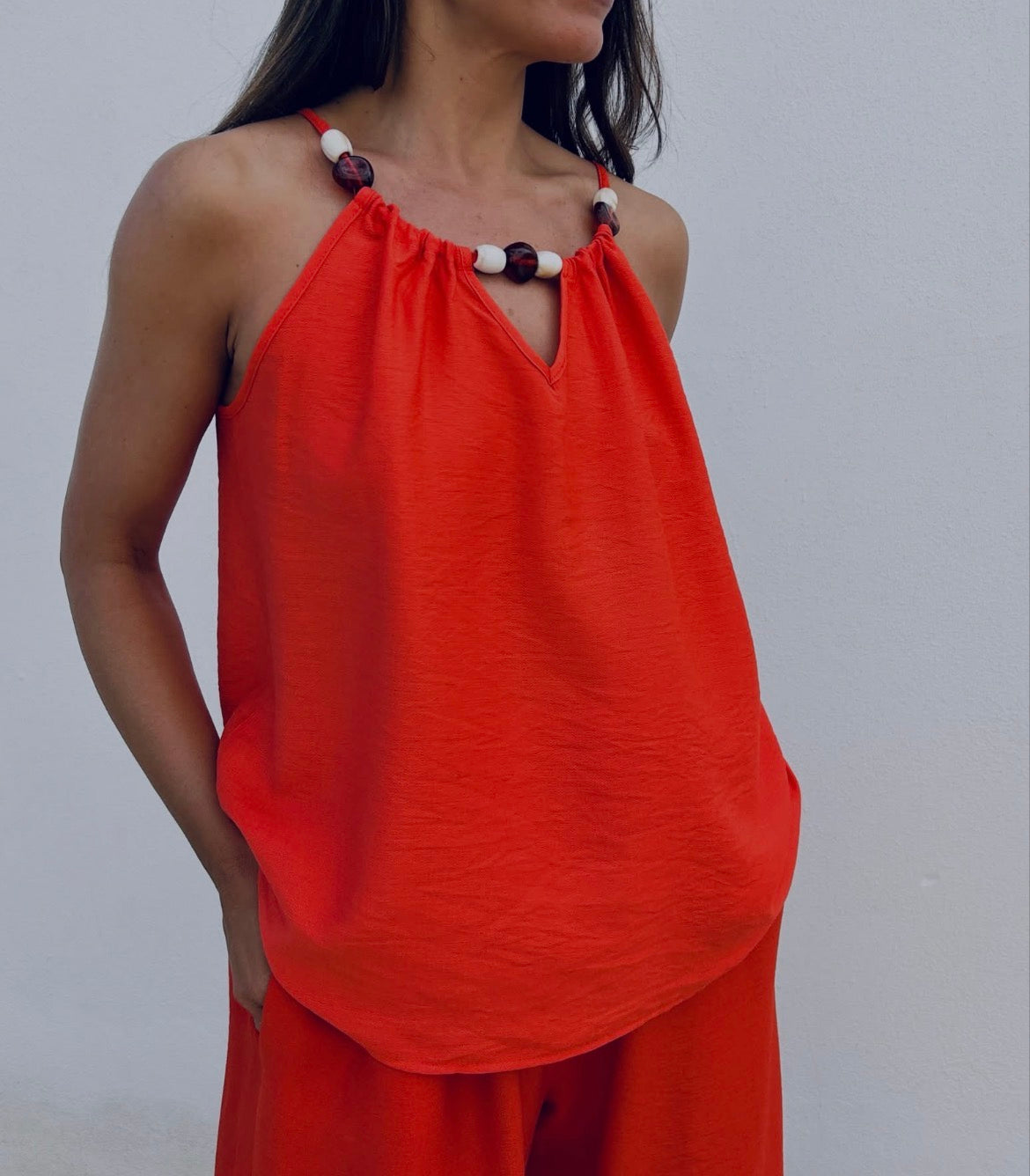 Top débardeur couleur corail avec perles